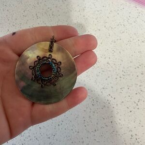Round Bronze Pendant with Intricate Design